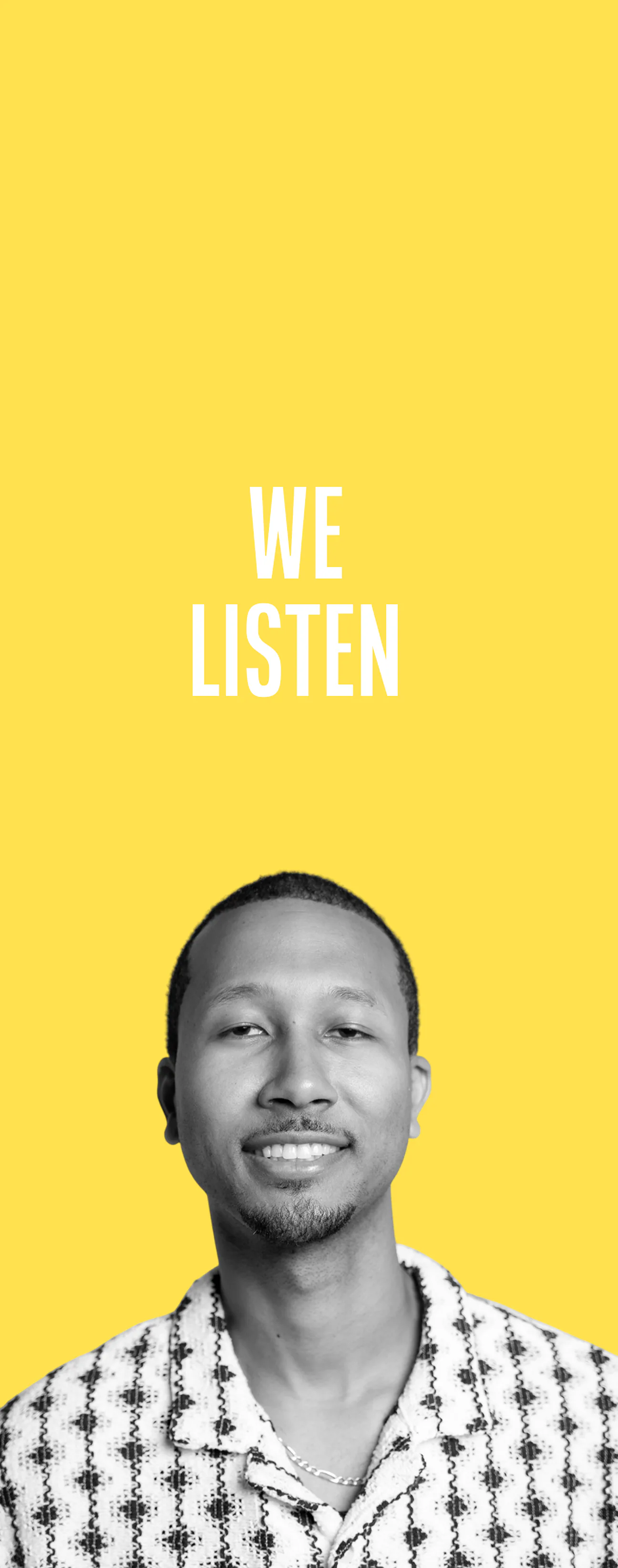 Smiling man with short hair and goatee wearing a patterned shirt in front of a yellow background with the text 'WE LISTEN' above his head.